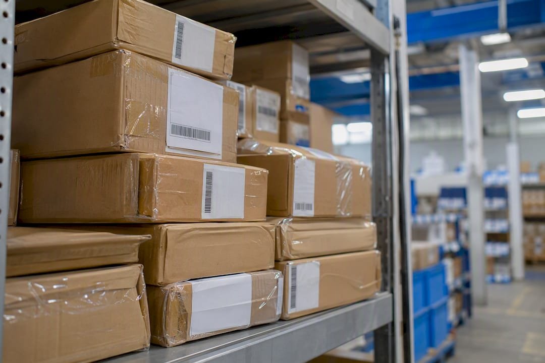 Stack of sealed parcels with manifest labels on pallet