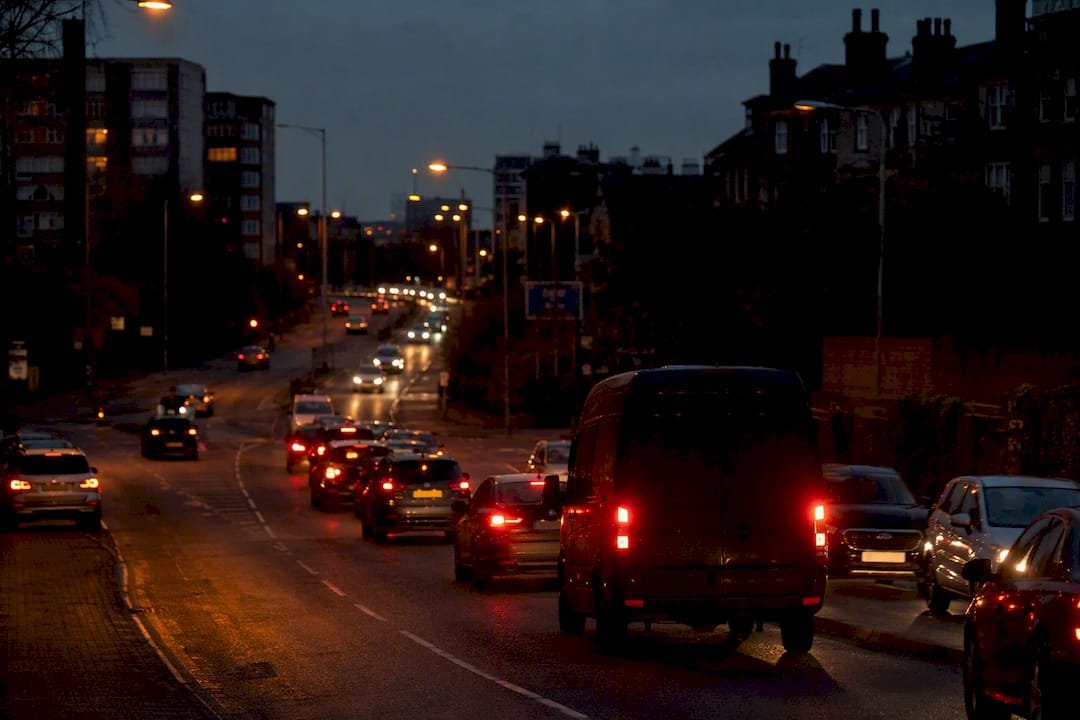 Delivery van silhouette in city traffic congestion
